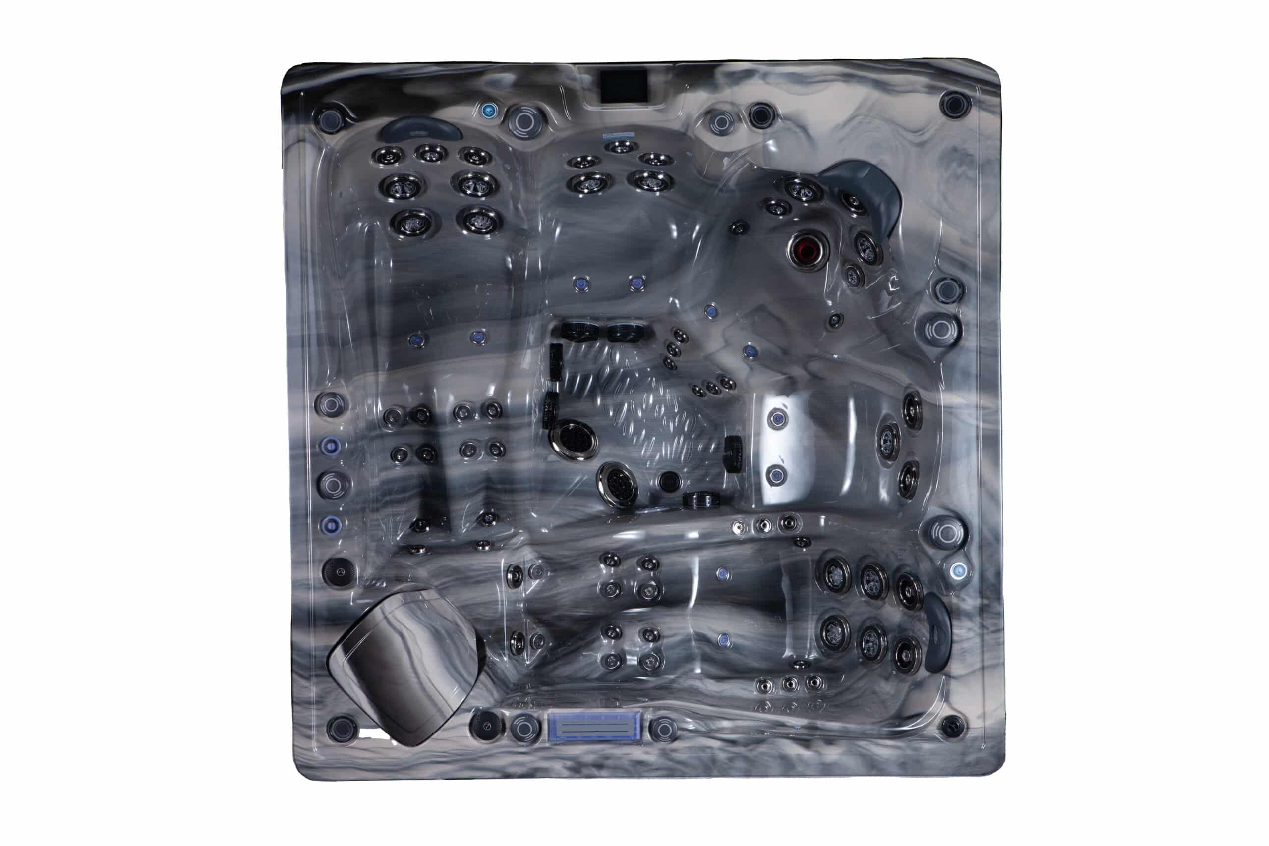 Intérieur d'un spa ou jacuzzi carré à coque acrylique gris marbré, montrant de nombreux jets noirs et bleus, un coussin de tête et un panneau de contrôle.